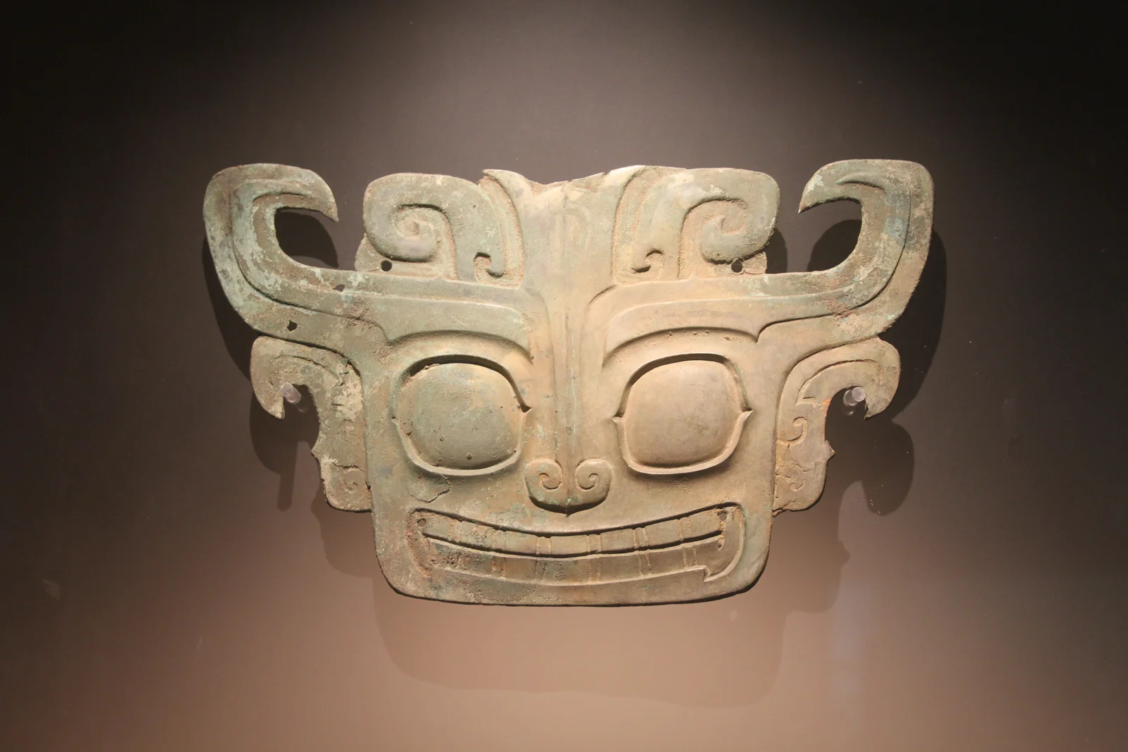 An ancient bronze animal mask displayed at the Sanxingdui Museum