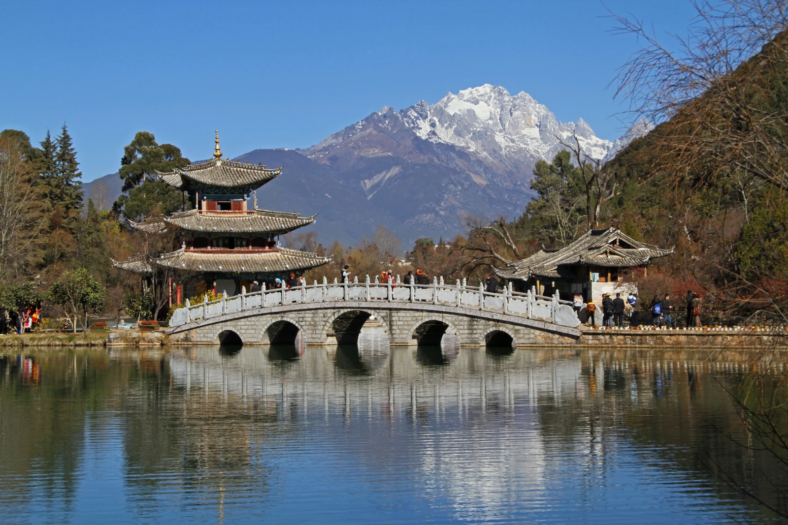 Jade Dragon Snow Mountain and a pavilion reflected in Lijiang’s Black Dragon Pool