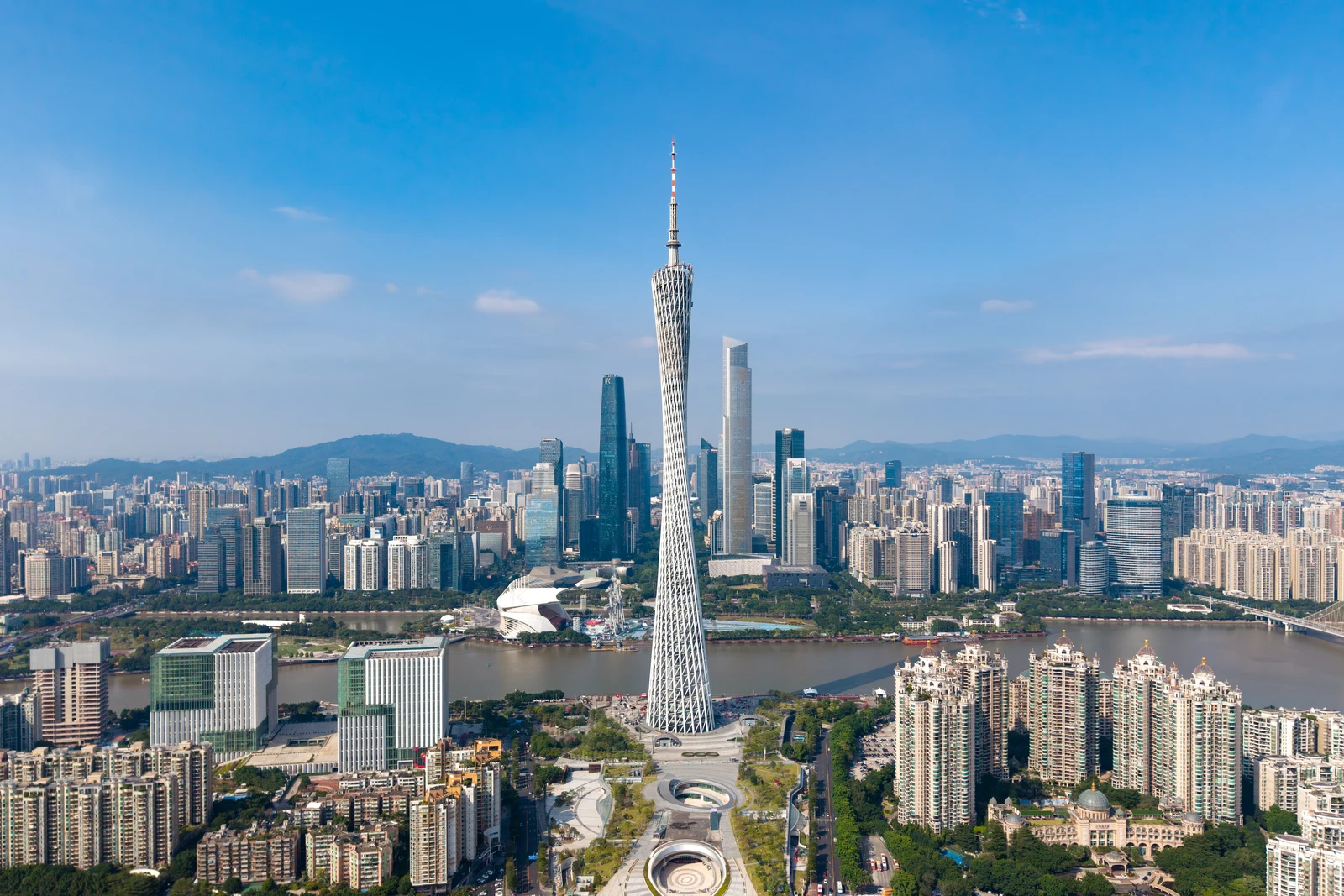 Canton Tower and Guangzhou’s Pearl River skyline under a clear blue sky
