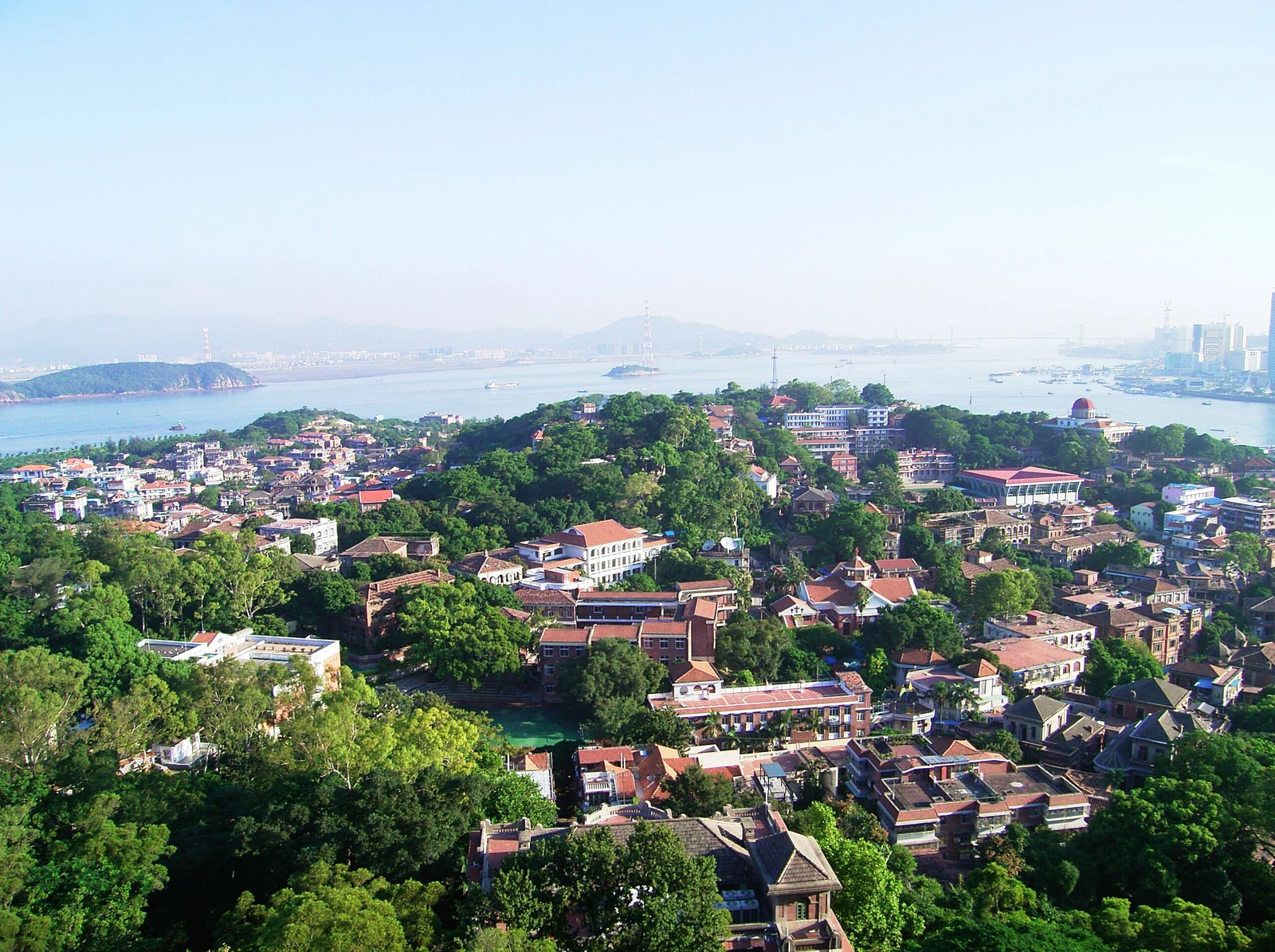 Red-roofed villas and green hills on Gulangyu Island above Xiamen’s blue coast